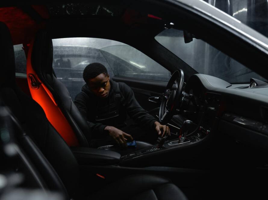 mobile car detailer cleaning luxury car interior